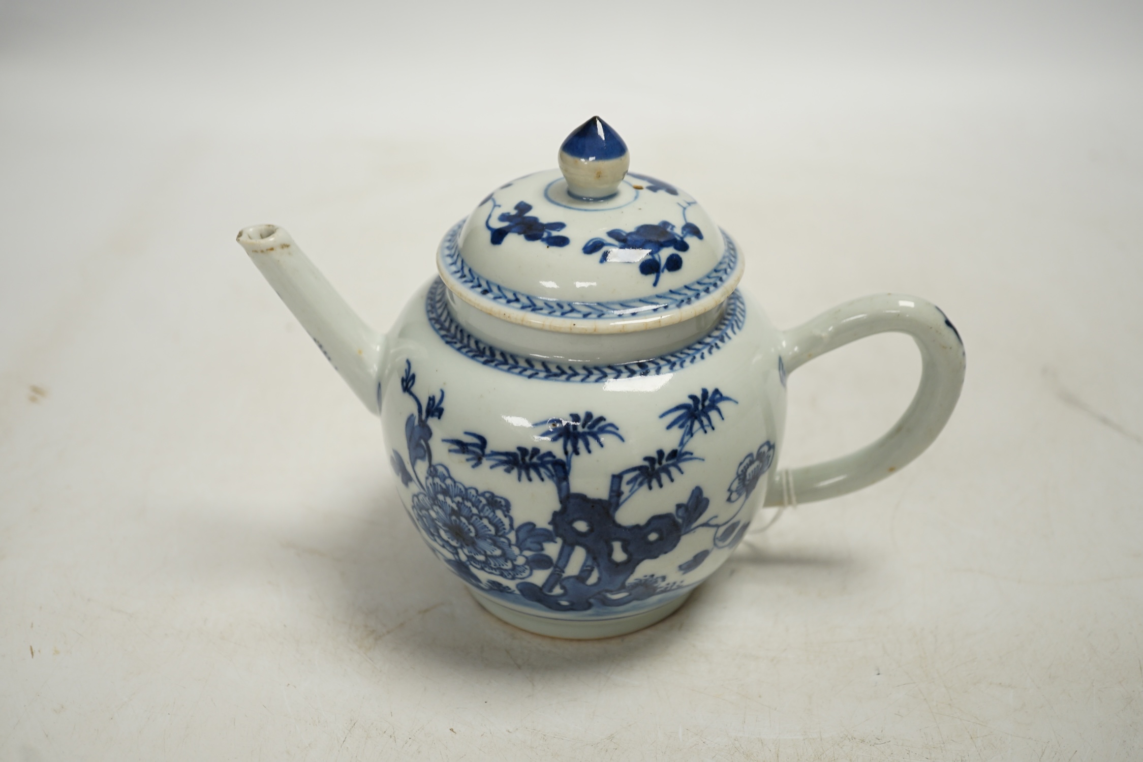 A Chinese blue and white teapot and cover, Qianlong period, 13cm high. Condition - fair